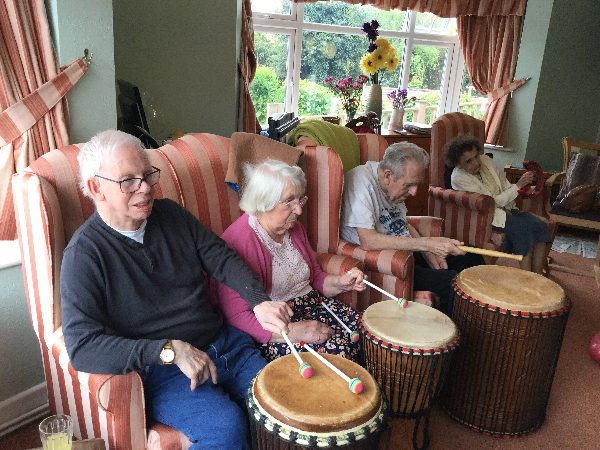 Primrose Lodge Southbourne Care Home residents playing drums